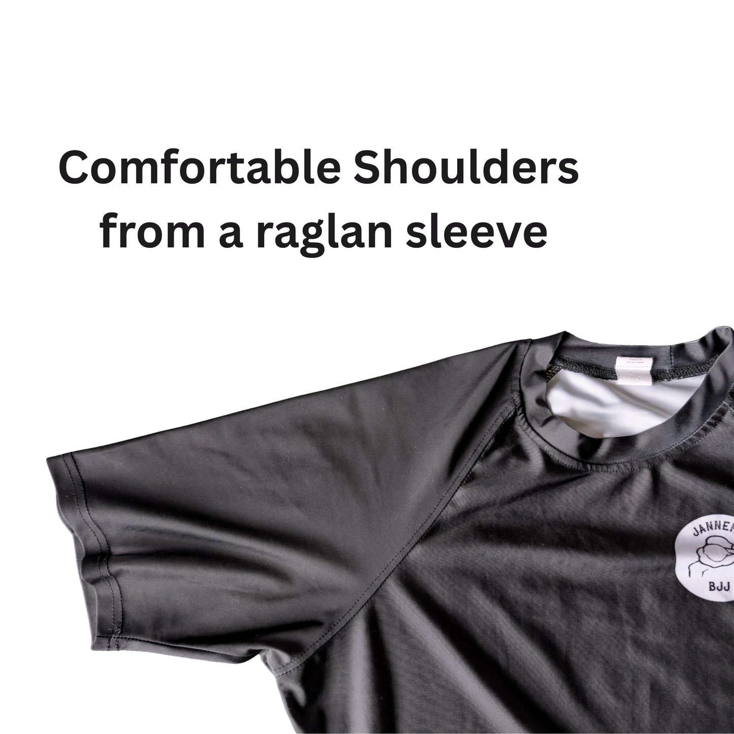 Black athletic BJJ rash guard with raglan sleeves on a white background