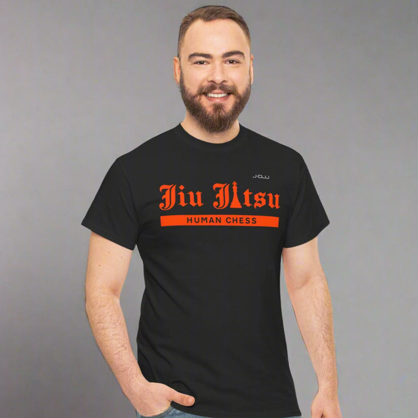 Man wearing a black Jiu Jitsu t-shirt with orange text on a white background