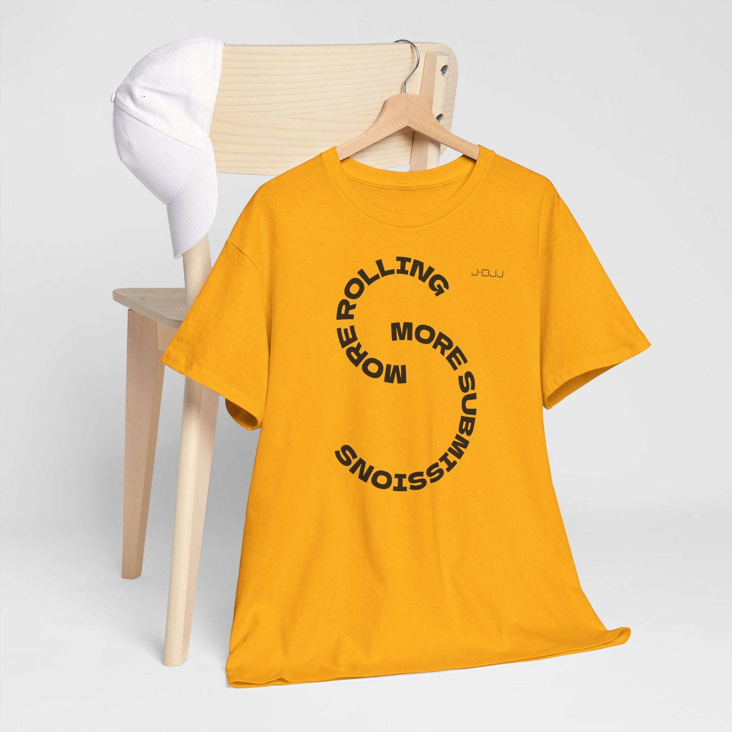 Yellow t-shirt with black text on a wooden hanger against a white background