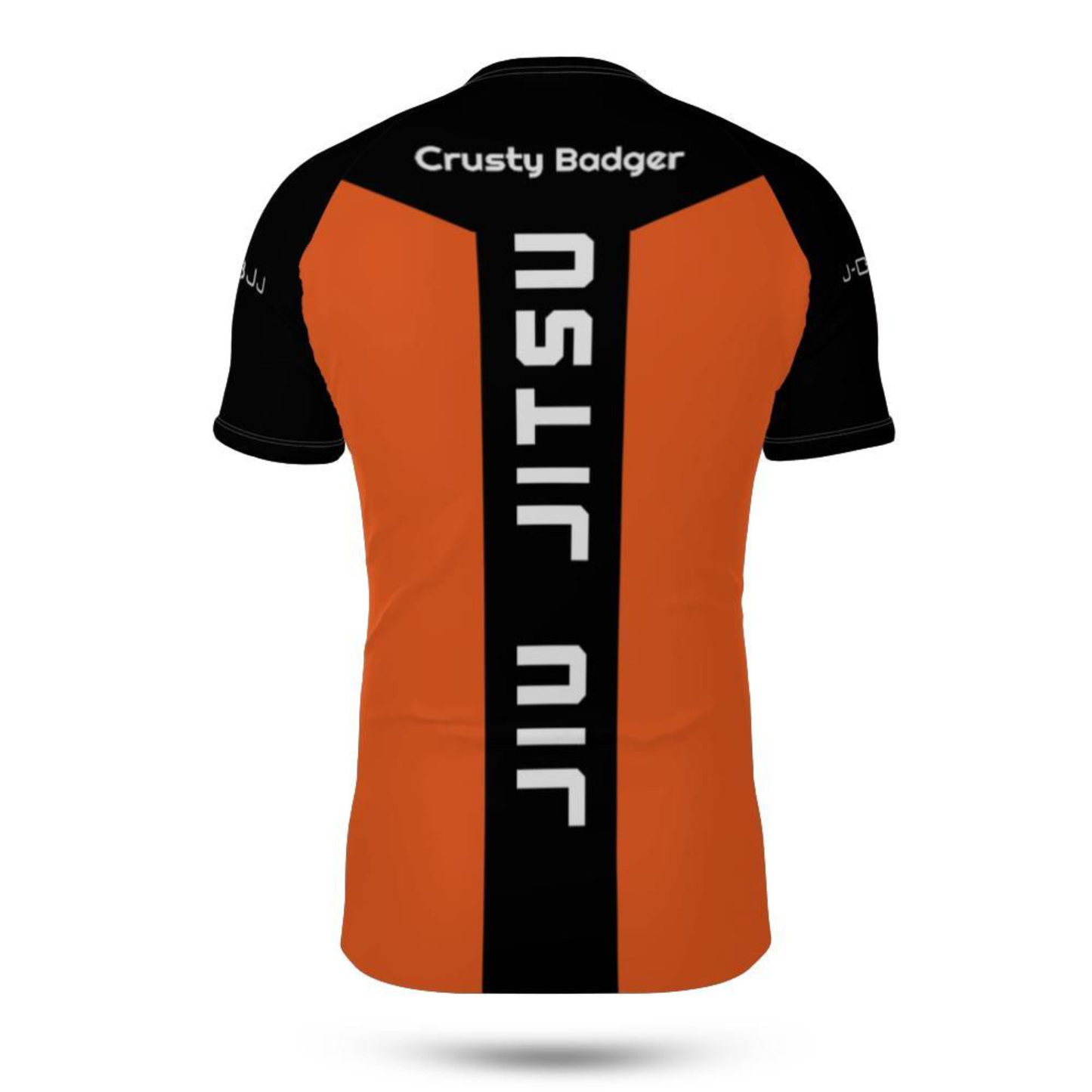 Orange and black Rash Guard with 'Crusty Badger' and 'Jiu Jitsu' text on a white background