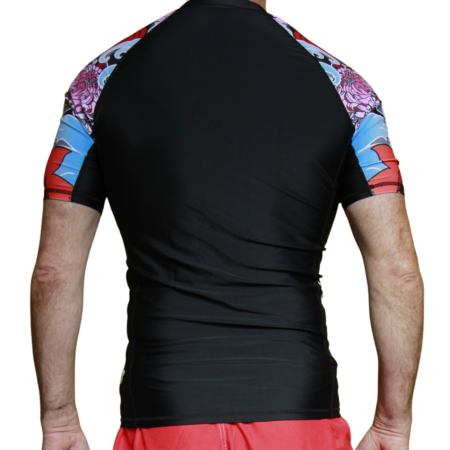 Black Brazilian Jiu Jitsu rash guard with colorful sleeves on a white background