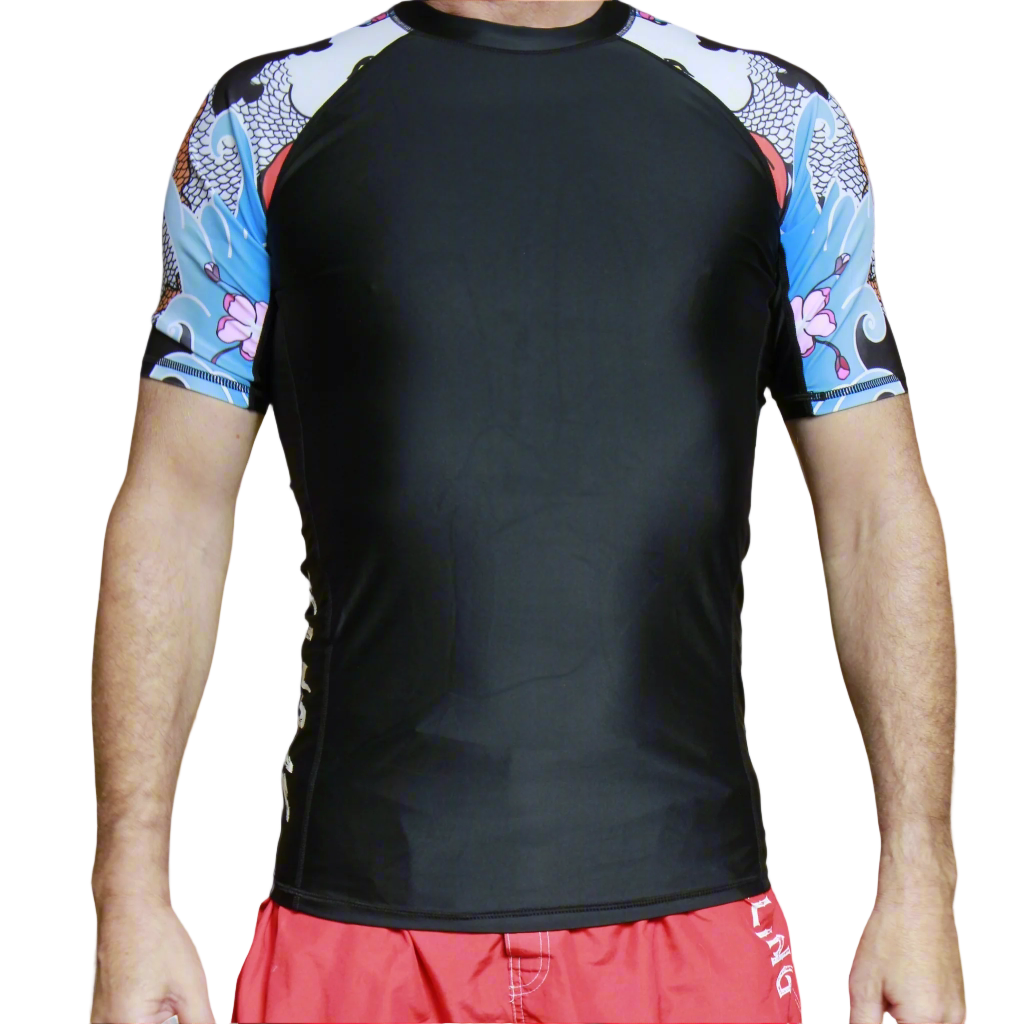 Black Jiu Jitsu rash guard with colorful short sleeves worn by a person on a white background
