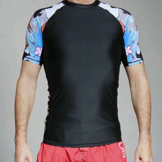 Black Jiu Jitsu rash guard with colorful short sleeves worn by a person on a white background