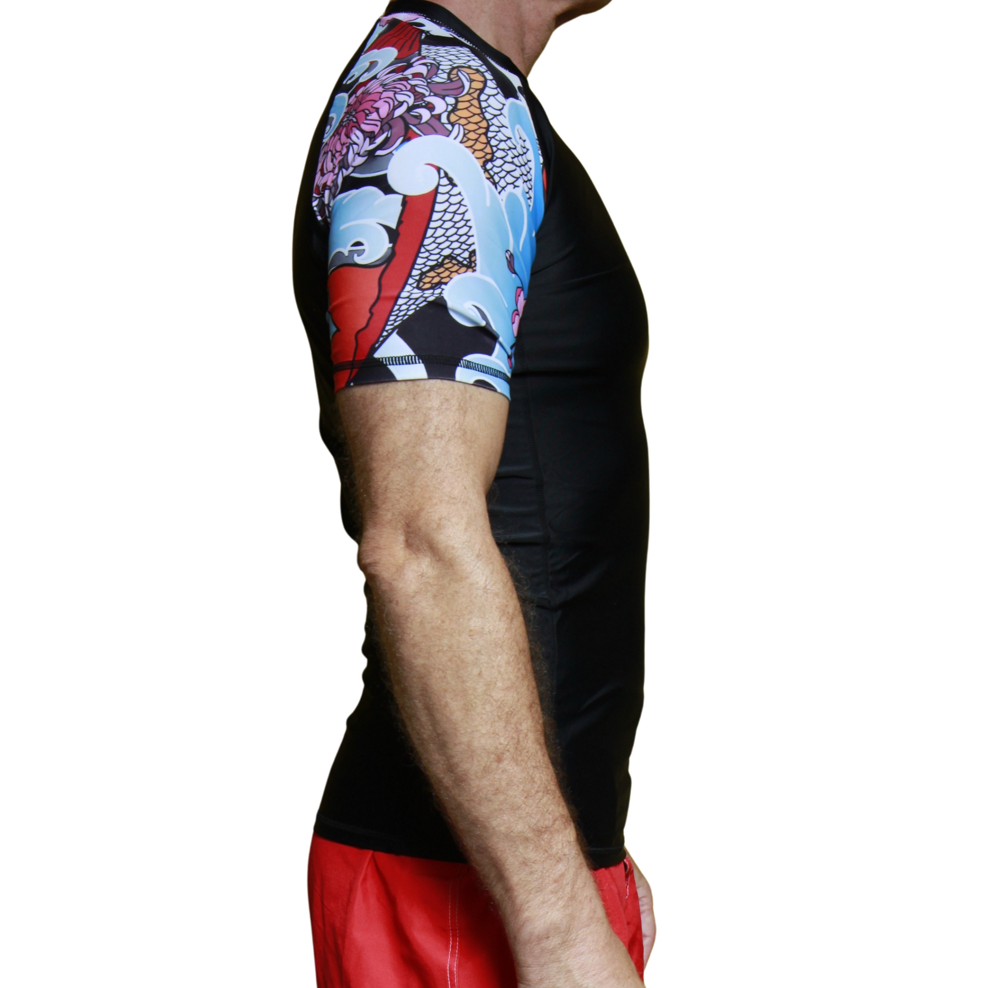 Person wearing a black short  sleeve BJJ rash guard.  Colorful arm sleeve design. White background
