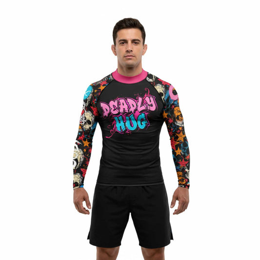 Person wearing a black BJJ Rash Guard. Colorful sleeves and 'Deadly Hug' text. White background.