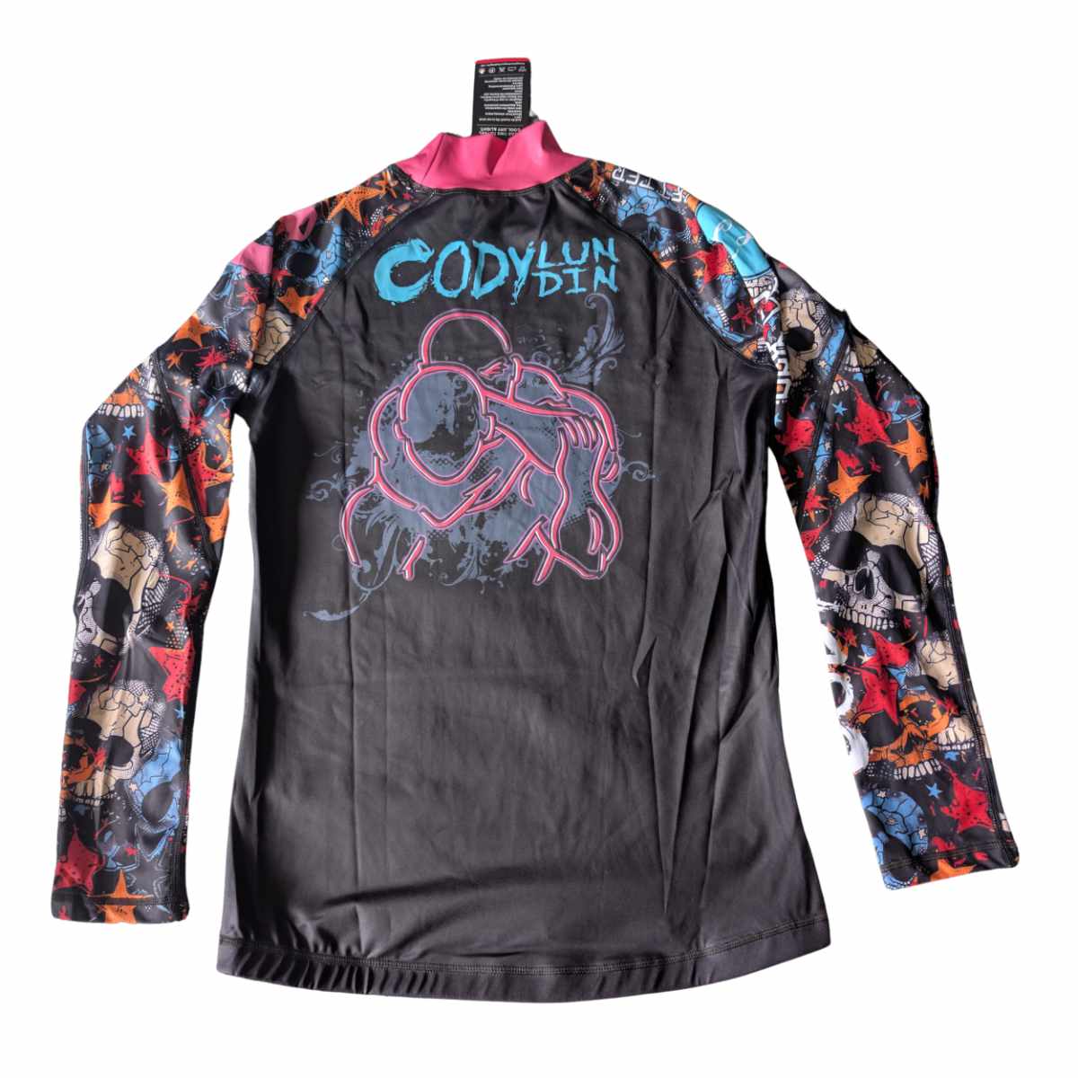 Black long-sleeve BJJ Rash Guard. Colorful sleeves and graphic design. White background