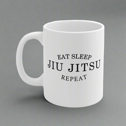 White mug with 'Eat Sleep Jiu Jitsu Repeat' text on a white background