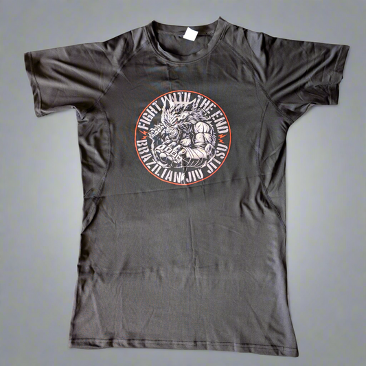 black rash guard with a circular design featuring a beast and text on a white background