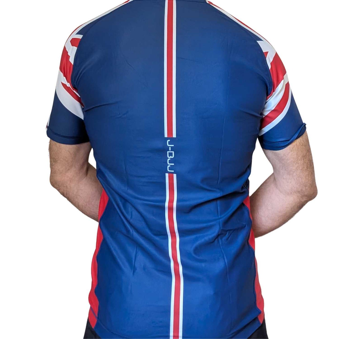 Blue BJJ rash guard with red and white accents on a white background