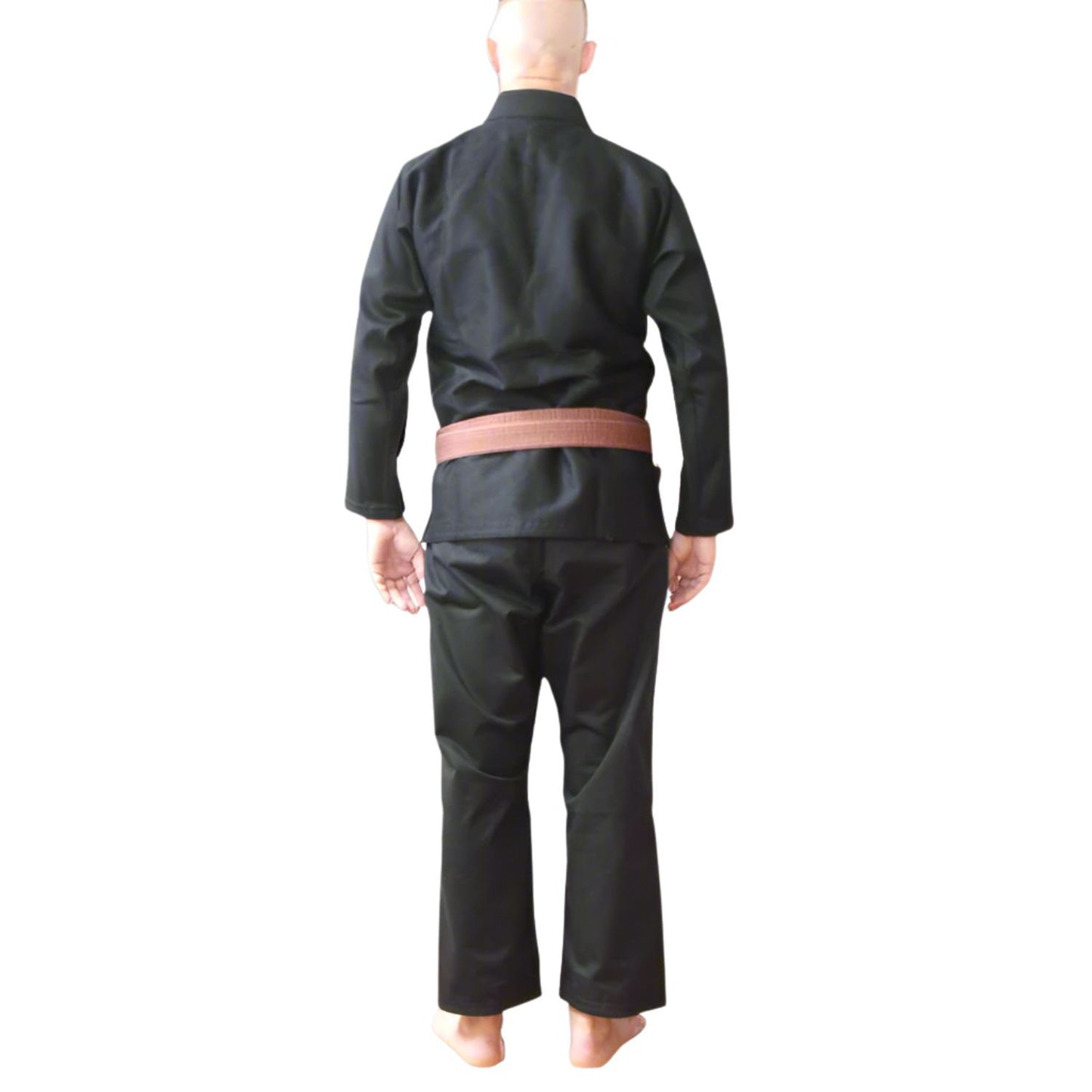 Person wearing a black BJJ gi with a brown belt on a white background