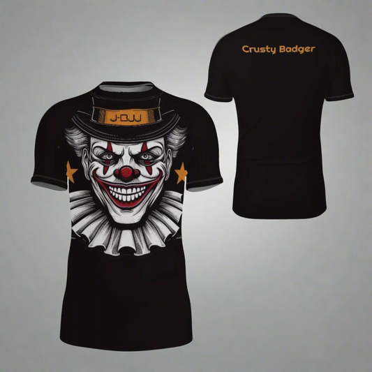 Black rash gaurd with clown graphic on the front and 'Crusty Badger' text on the back, displayed on a white background.