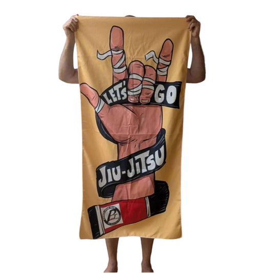 Towel with Jiu-Jitsu design held by a person on a white background
