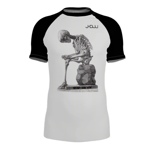 White and black jiu jitsu rash guard with skeleton design and 'J-BJJ' branding on a white background
