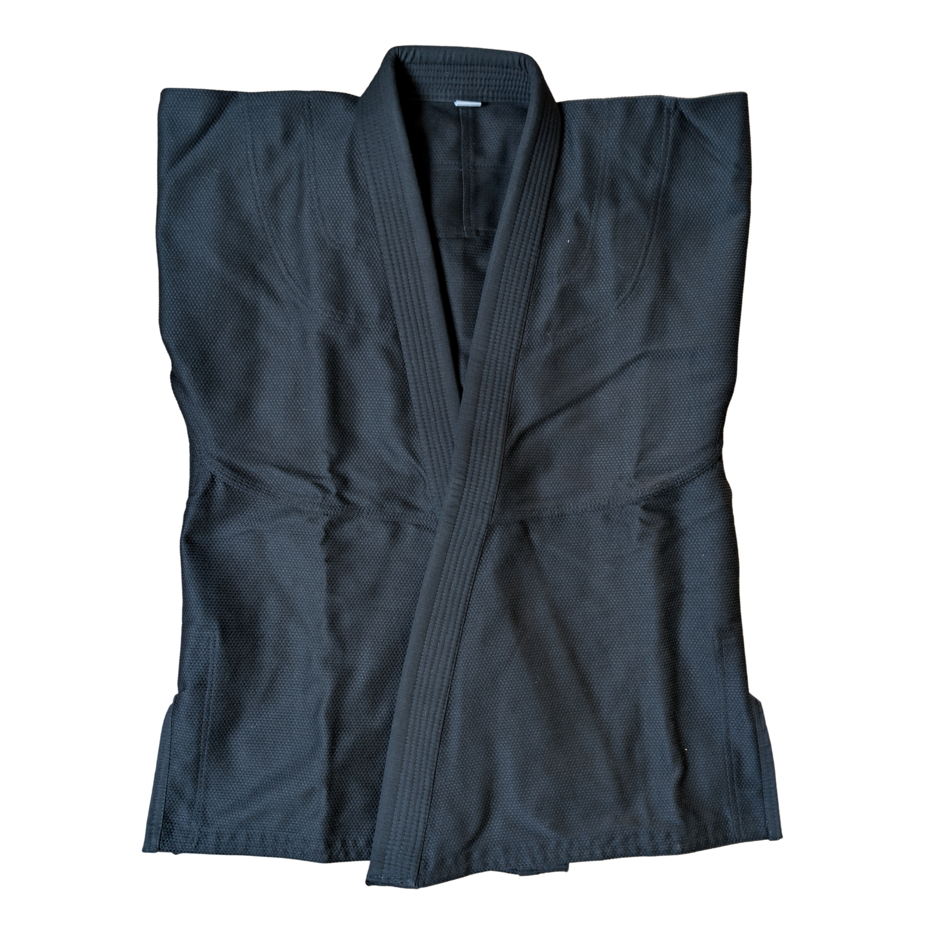 Folded raven black BJJ Gi front view on a white background